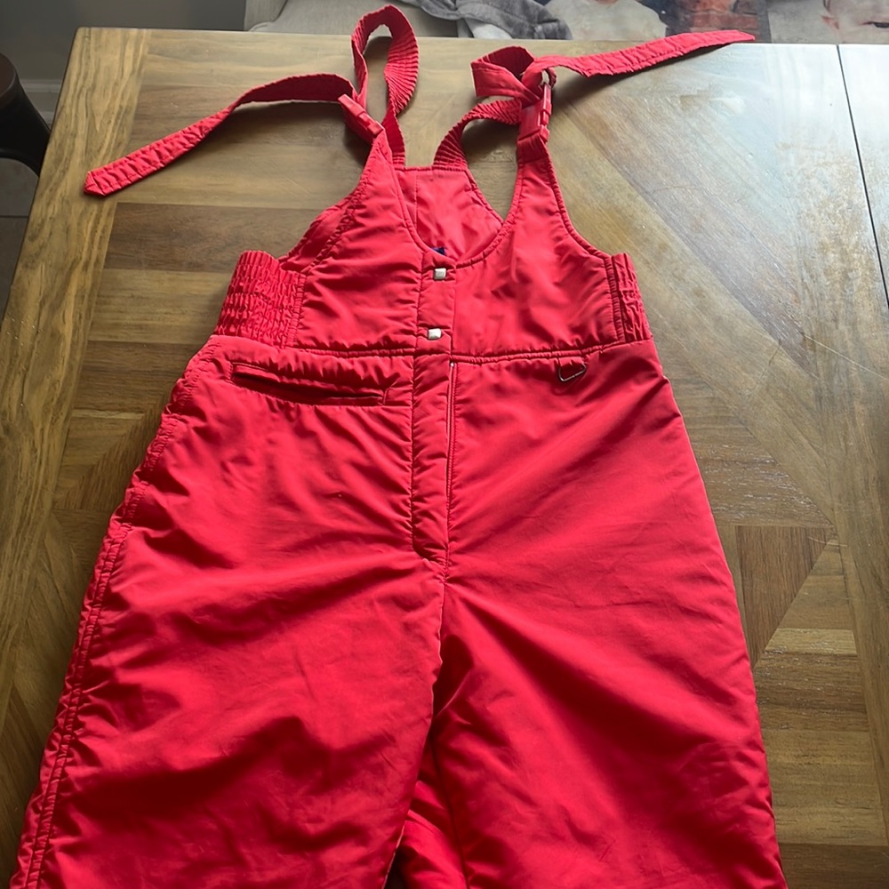 Red ski bibs.